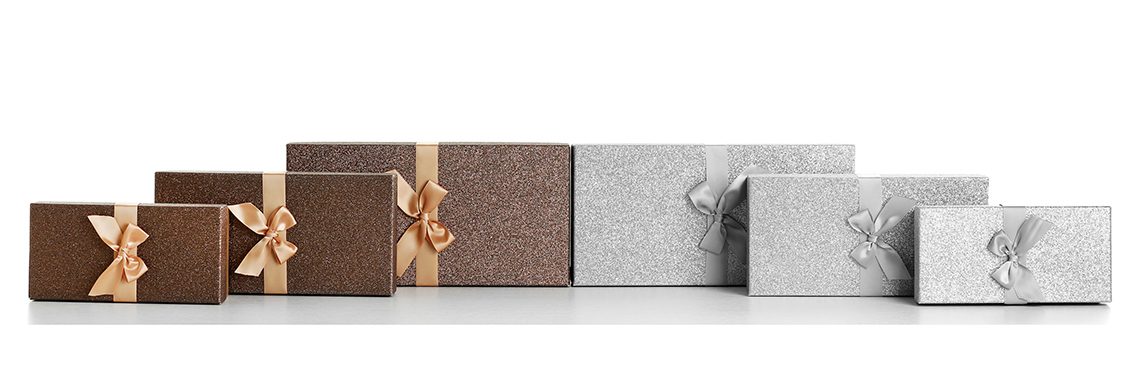 Beautiful brown and silver Christmas gifts isolated on white background